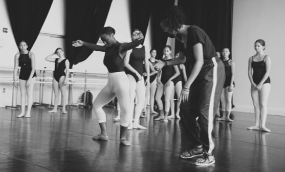 Instructor teaching ballet stduents